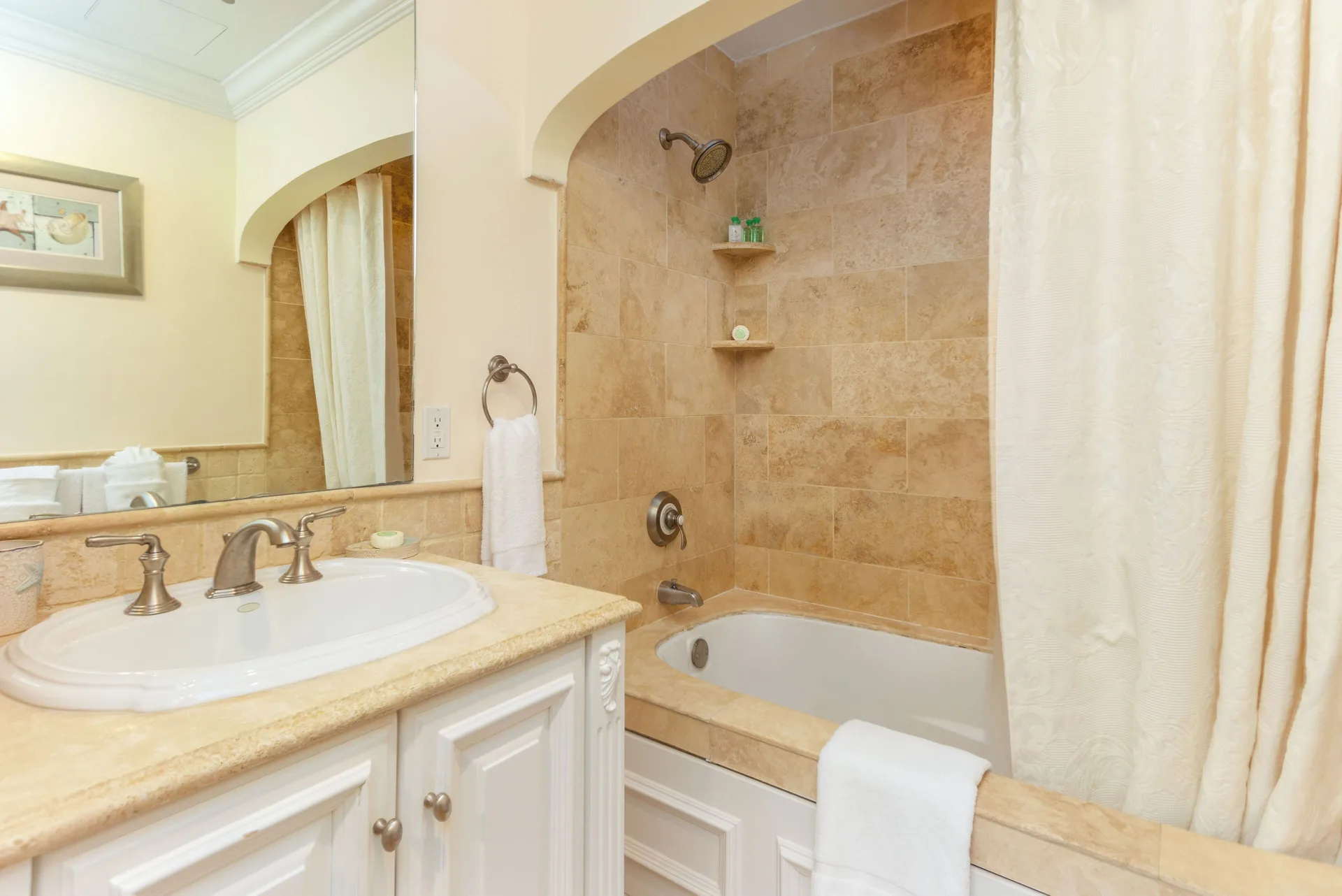 Villa ocean view bathroom with vanity and tub-shower alcove at The Somerset on Grace Bay.