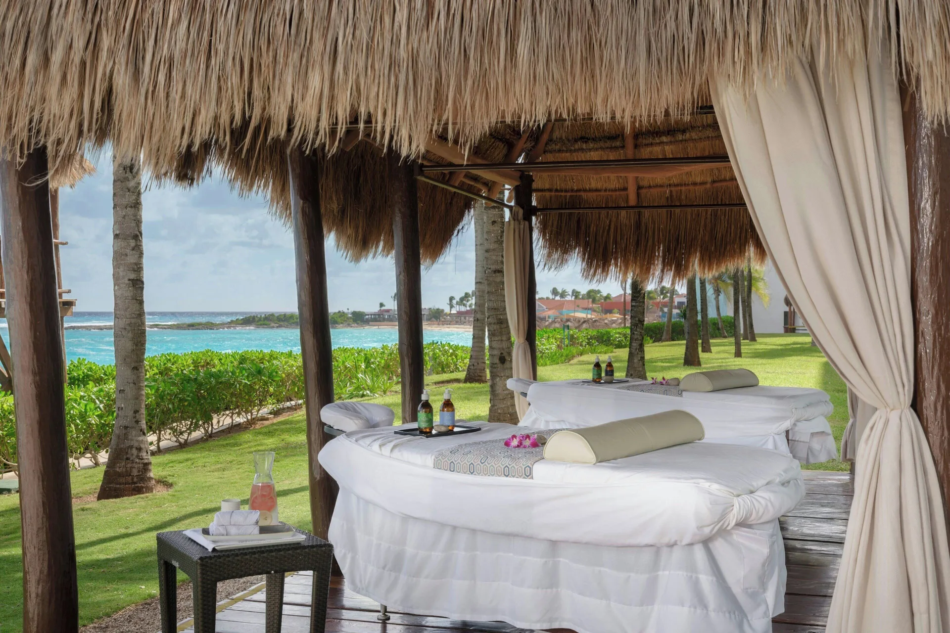 Beachfront spa palapa with massage tables at The Westin Resort & Spa, Cancun.