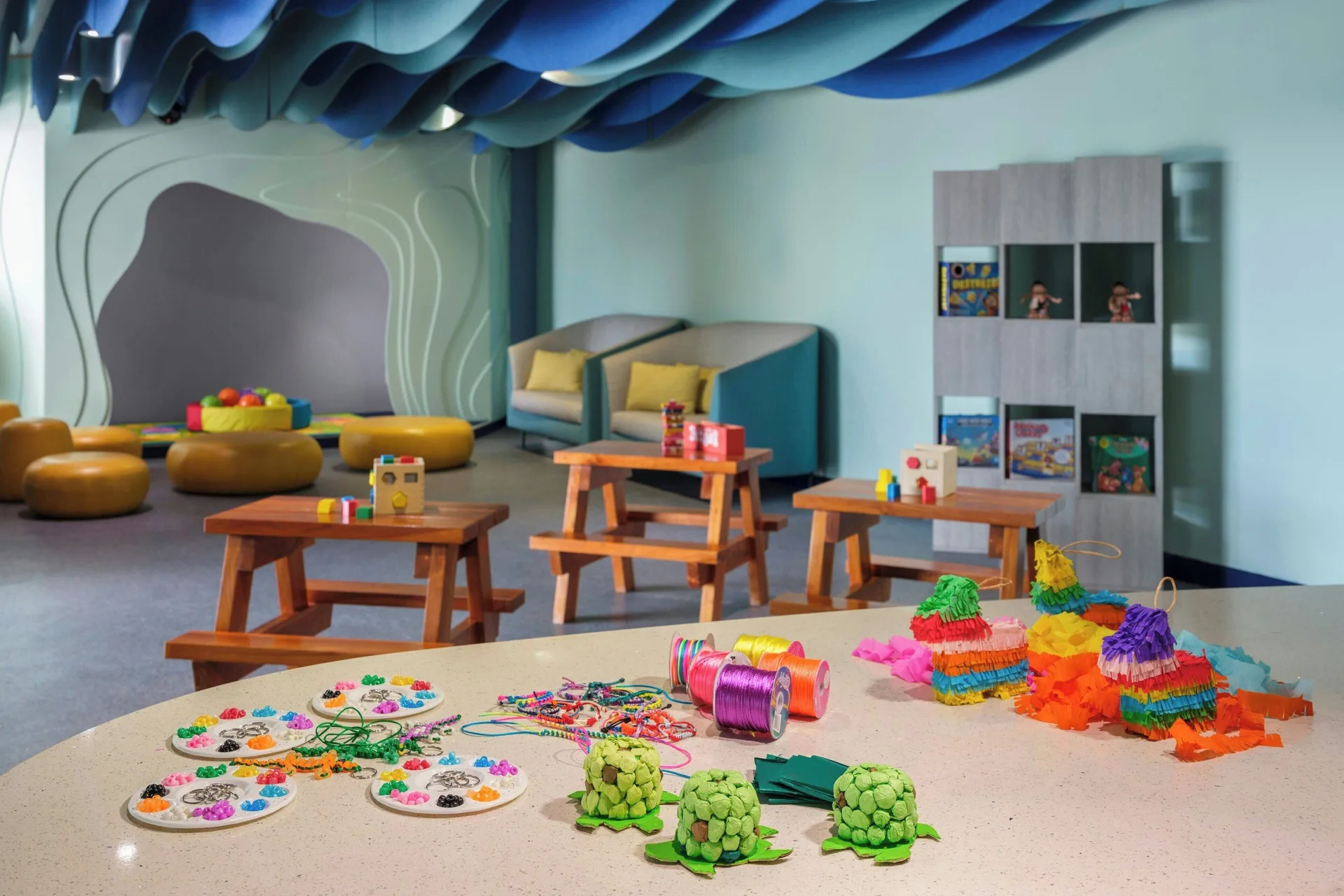 Children's activity room with craft supplies and play tables at The Westin Resort & Spa, Cancun.