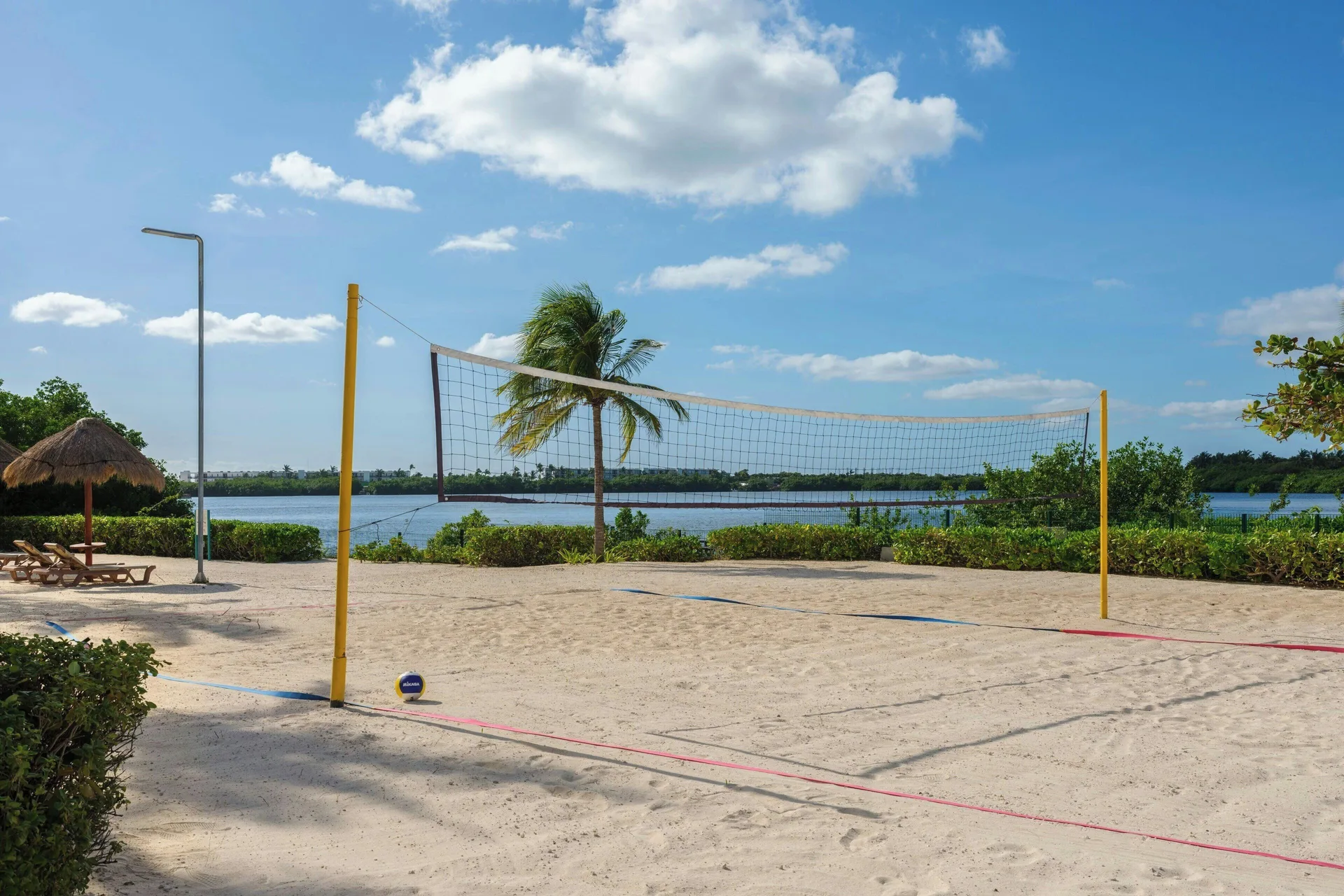 Sand volleyball court beside the lagoon at The Westin Resort & Spa, Cancun.