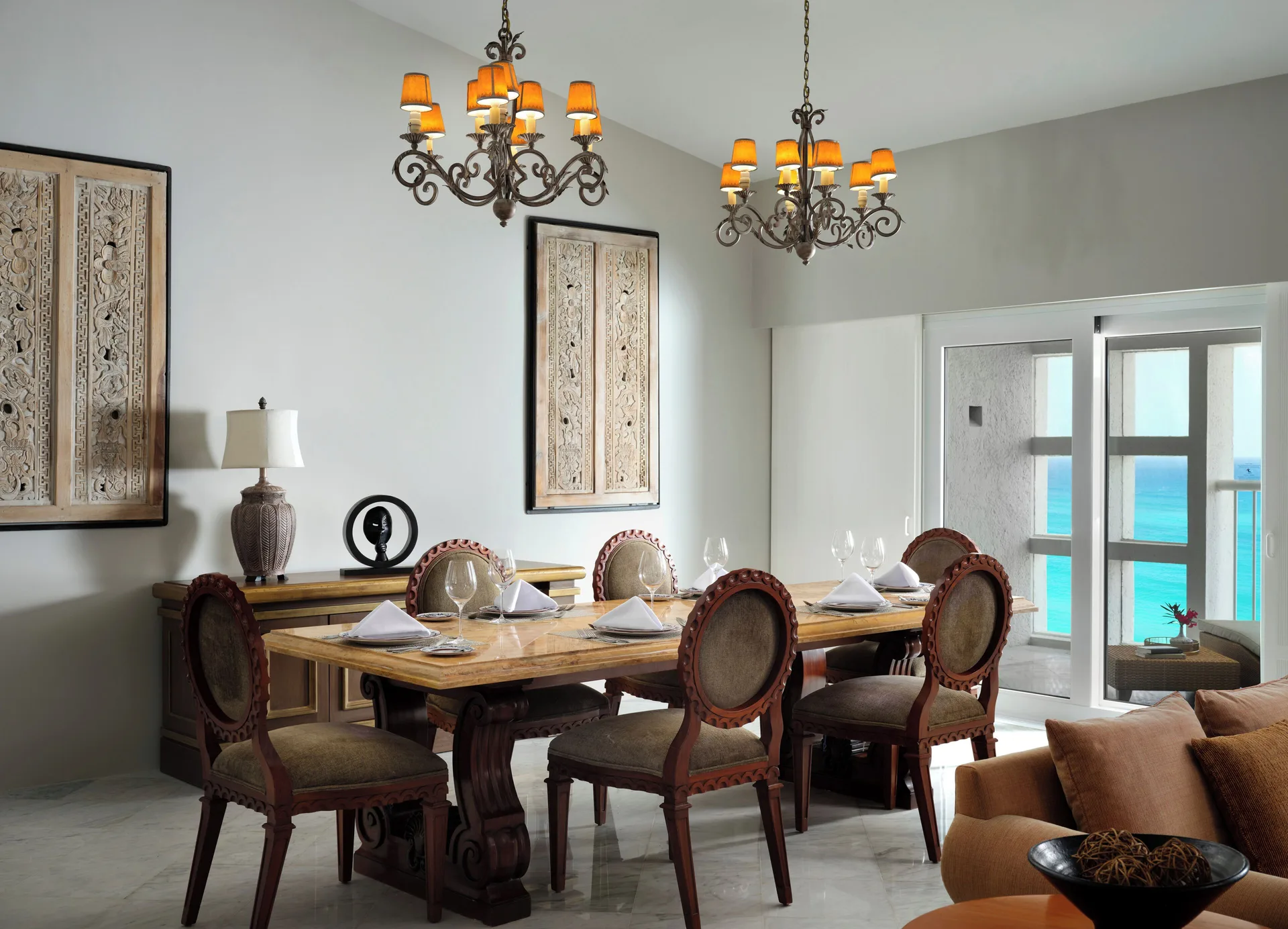Presidential Suite dining area set for six by ocean-view doors at The Westin Resort & Spa, Cancun.
