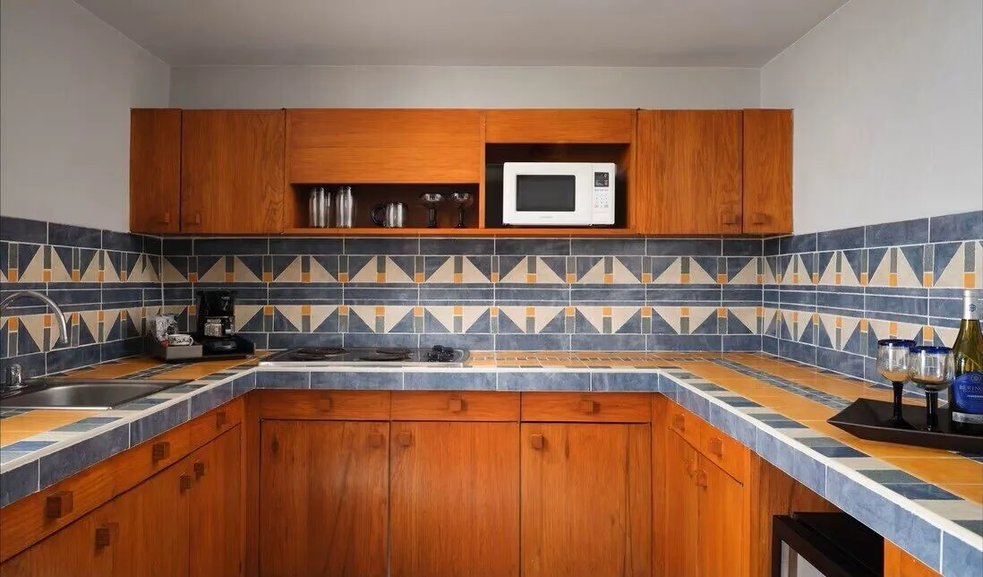 Presidential Suite kitchenette with microwave and tile backsplash at The Westin Resort & Spa, Cancun.
