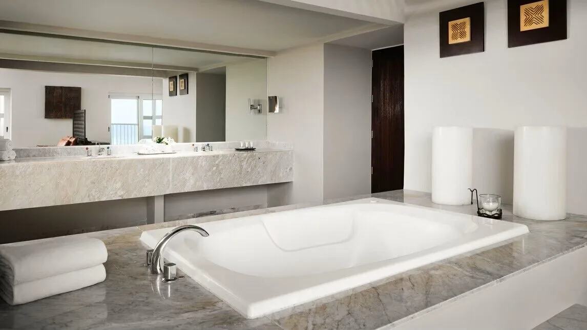 Presidential Suite bathroom with sunken tub and marble vanity at The Westin Resort & Spa, Cancun.