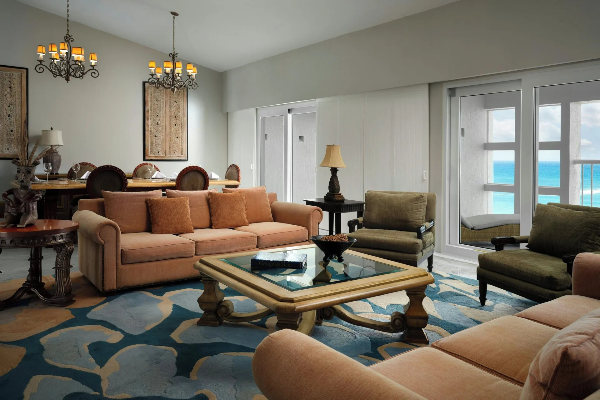 Presidential Suite lounge with dining table and balcony ocean view at The Westin Resort & Spa, Cancun.