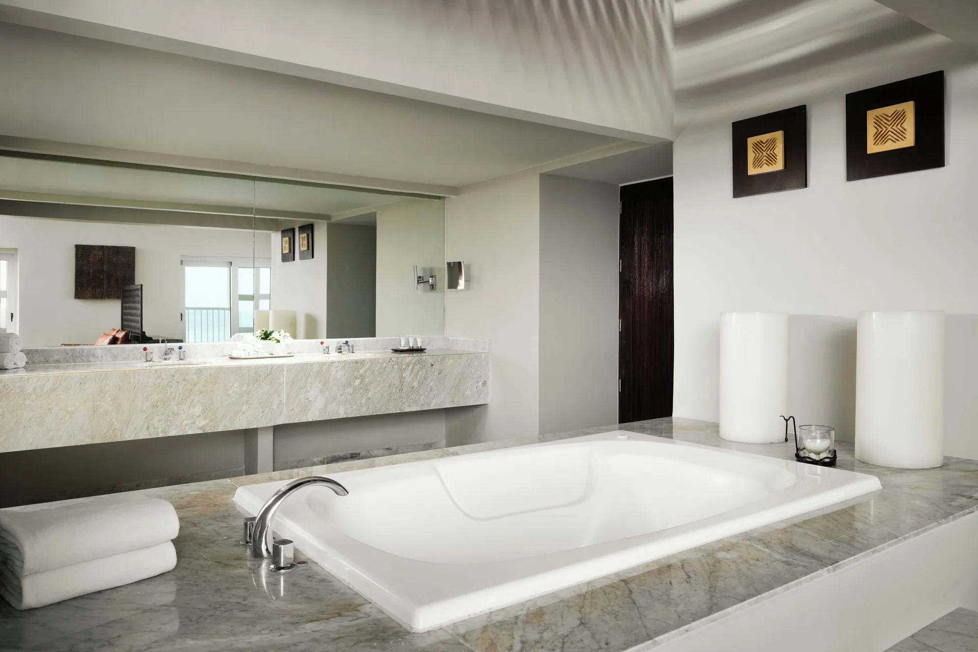 Royal Beach Club Presidential Suite at The Westin Resort and Spa Cancun with ocean view marble bathroom and king bed in Cancun Hotel Zone.