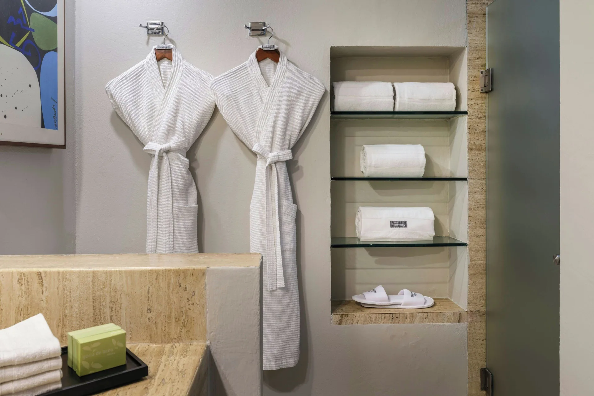 Bathroom robe area with folded towels in a Lagoon View room at The Westin Resort & Spa, Cancun.