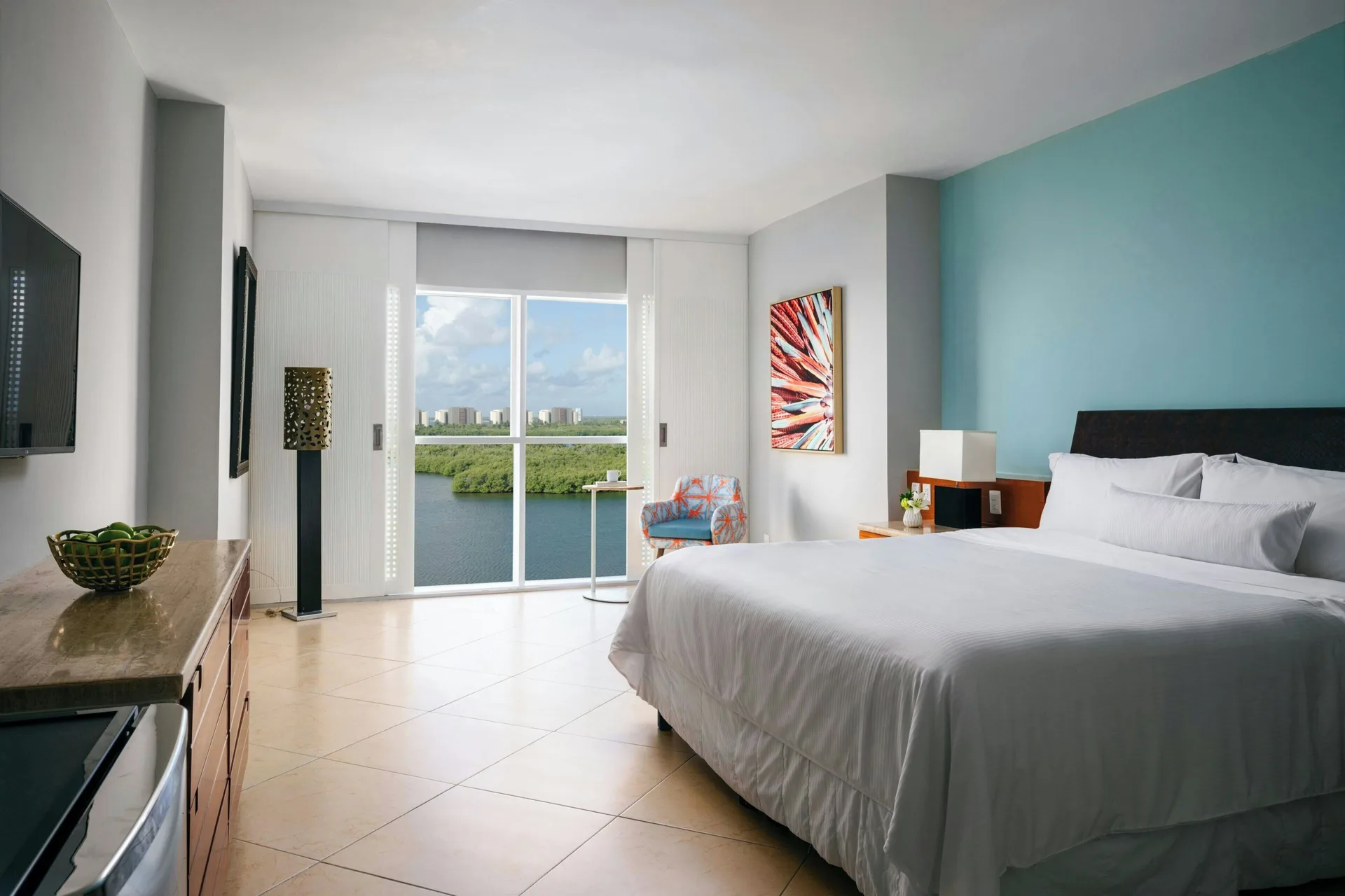 Lagoon View guest room with king bed and window at The Westin Resort & Spa, Cancun.
