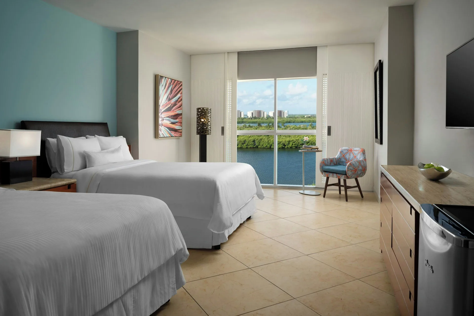 Lagoon View guest room with two beds and window at The Westin Resort & Spa, Cancun.