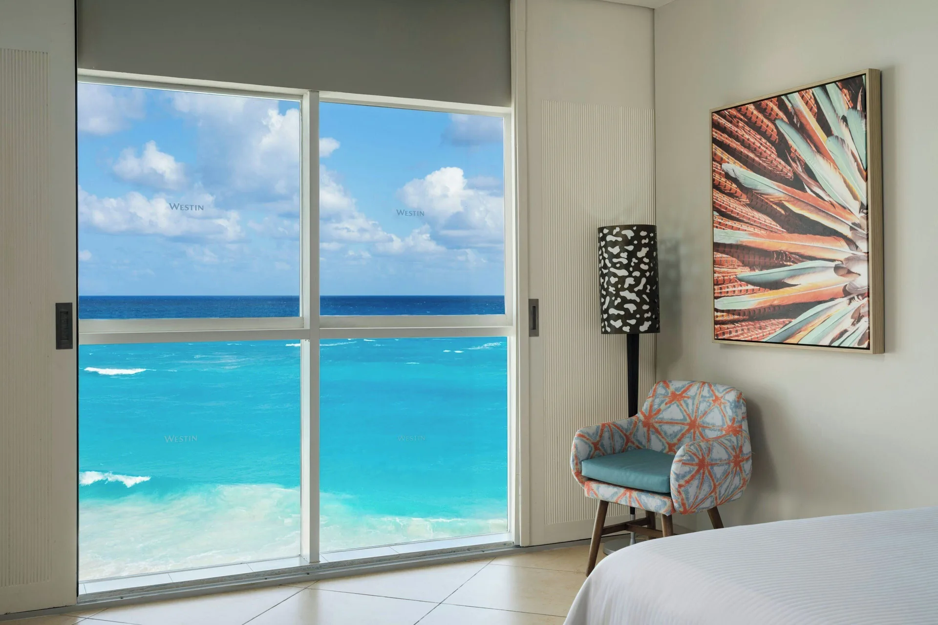 Ocean View room windows and seating area at The Westin Resort & Spa, Cancun overlook turquoise water.