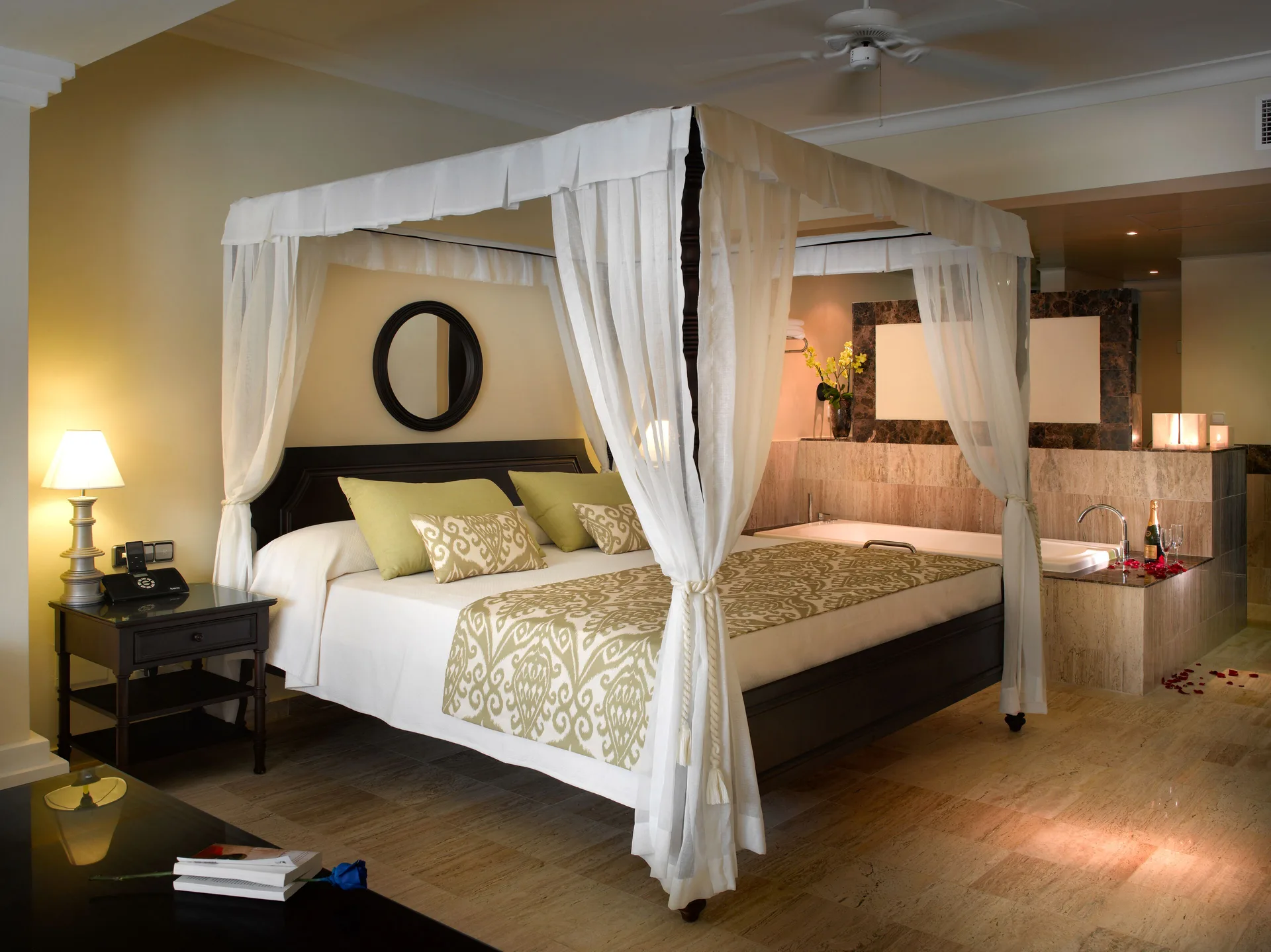 Canopy king bed suite with in-room bath at TRS Turquesa Hotel.