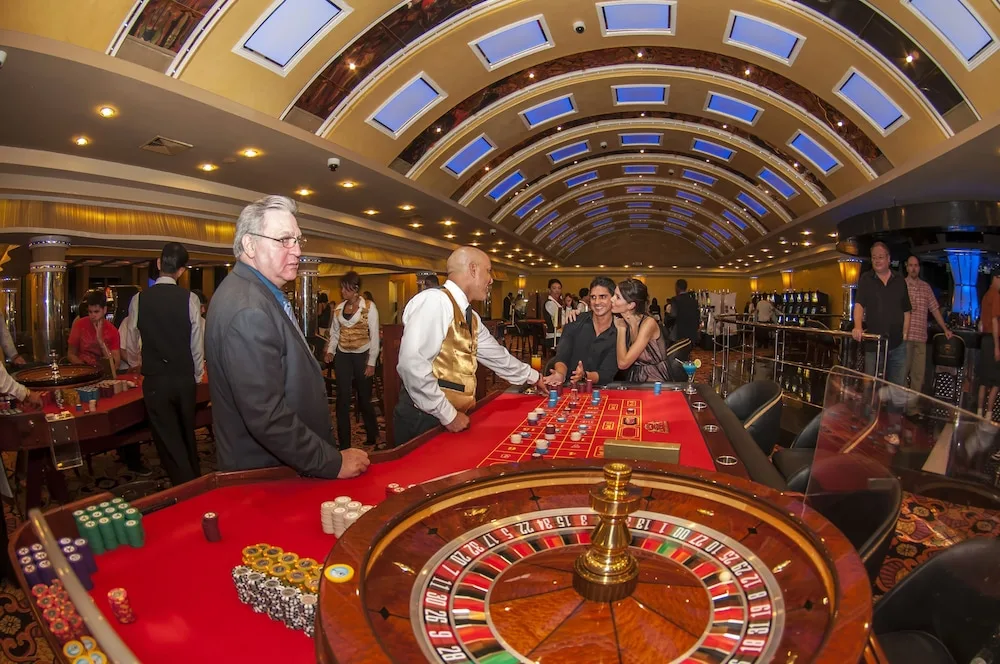 Casino floor with roulette and table games at TRS Turquesa Hotel.