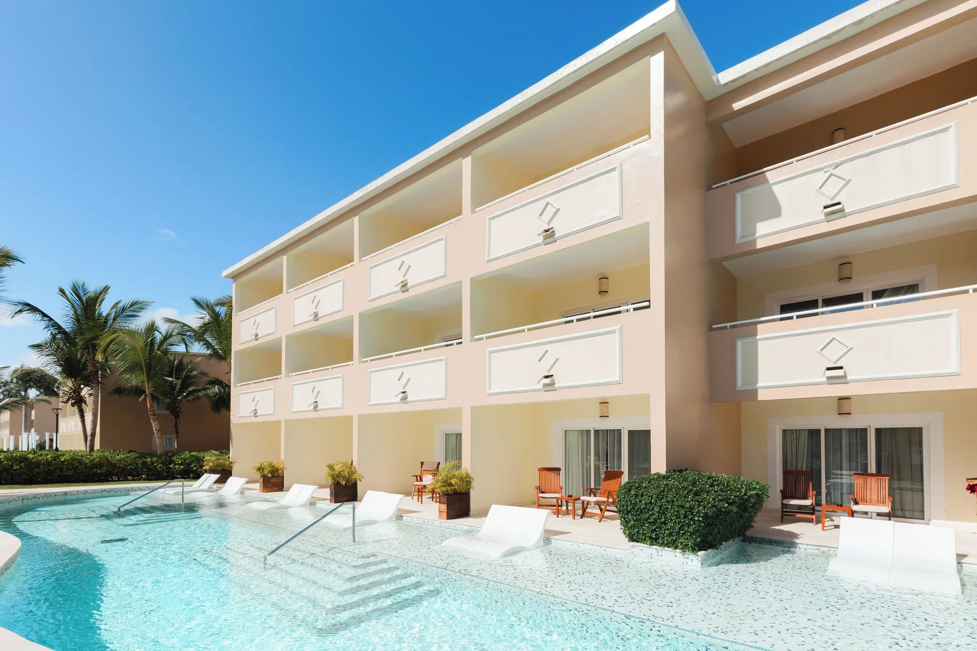 Poolside guestroom building with balconies at TRS Turquesa Hotel.