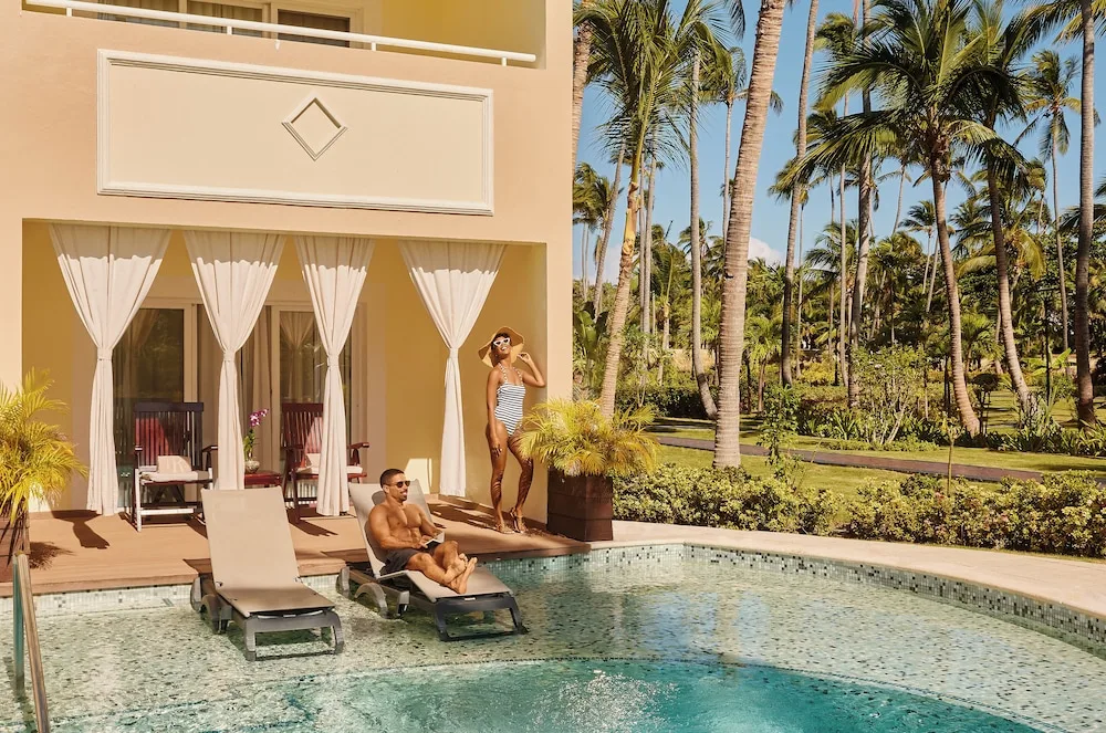 Swim-up pool terrace with loungers beside a suite at TRS Turquesa Hotel.