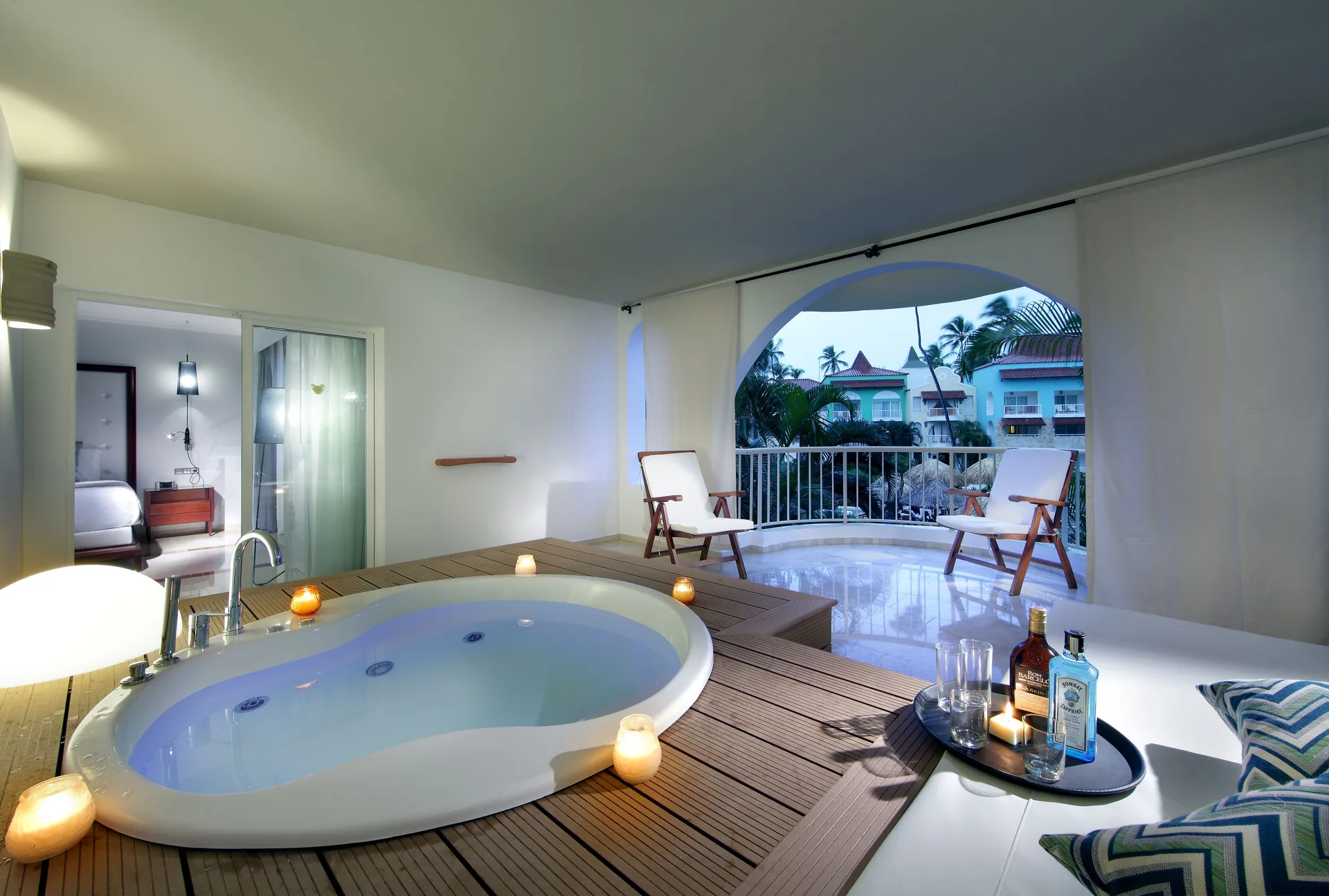 Terrace whirlpool with daybed and balcony chairs at TRS Turquesa Hotel.