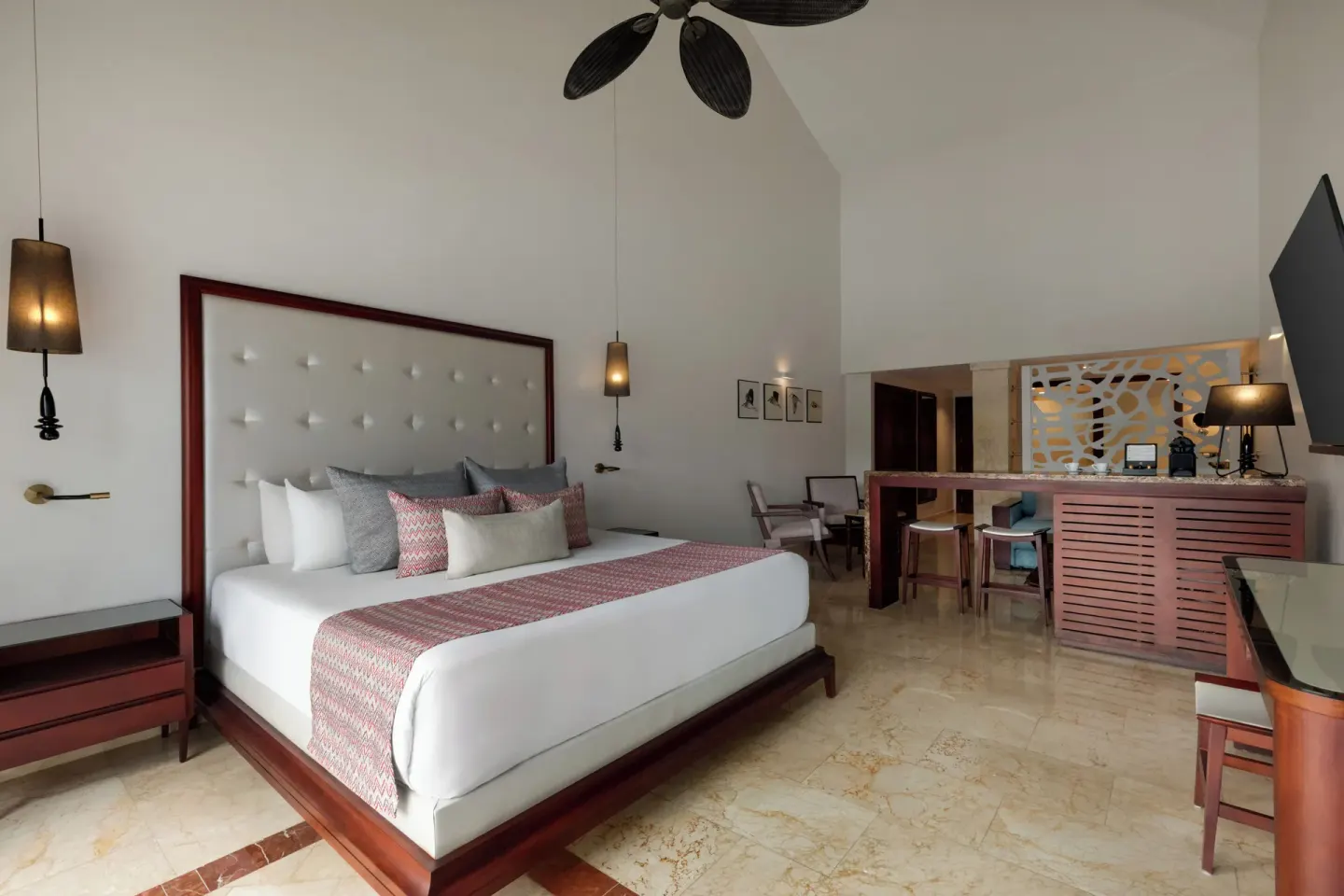 Jacuzzi Terrace Suite Beachside king bed and seating area at TRS Turquesa Hotel.