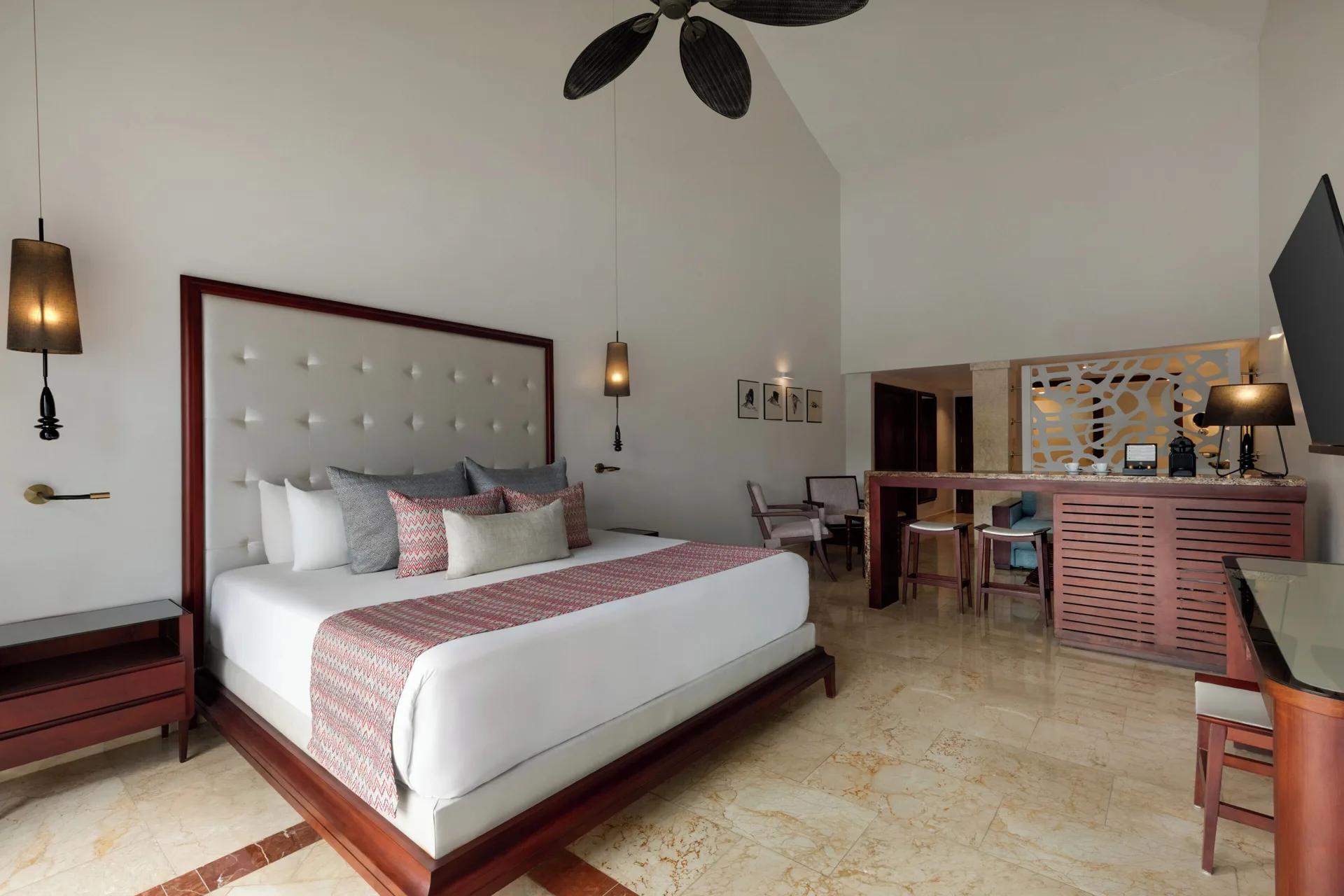 Jacuzzi Terrace Suite Beachside king bed and seating area at TRS Turquesa Hotel.