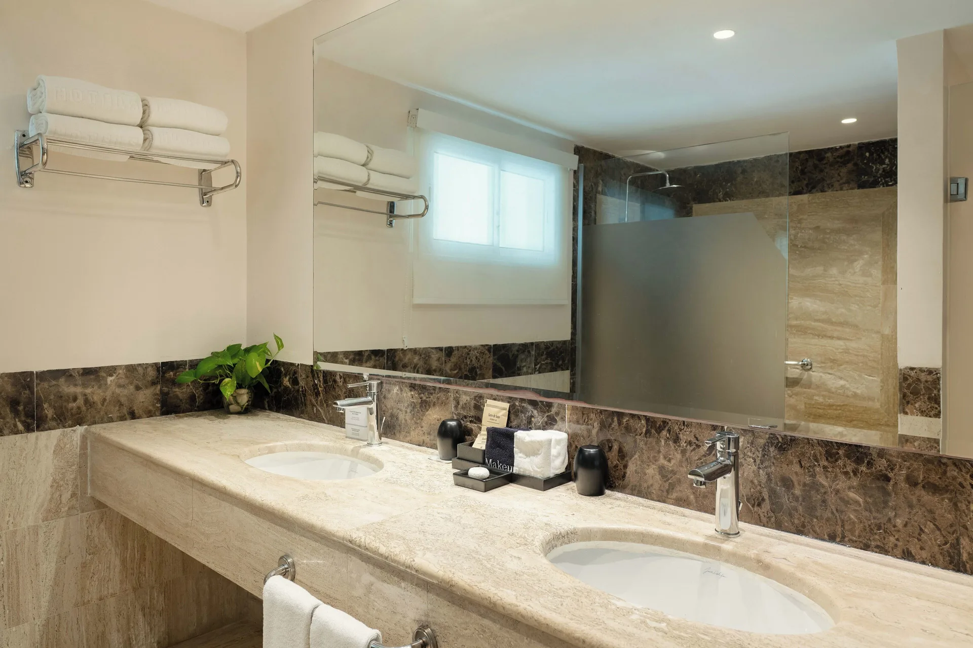 Romance Suite Swim Up bathroom vanity and shower area at TRS Turquesa Hotel.