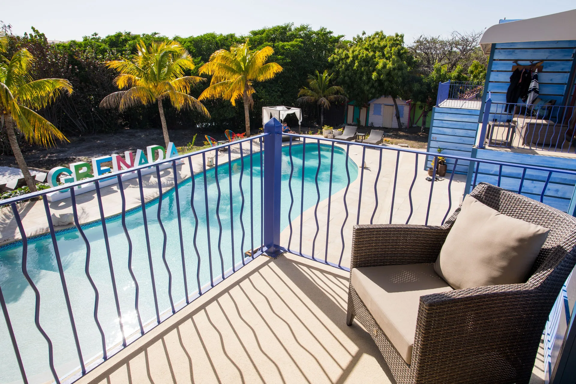 Cocoa Pod Room balcony overlooking the pool at True Blue Bay Resort.