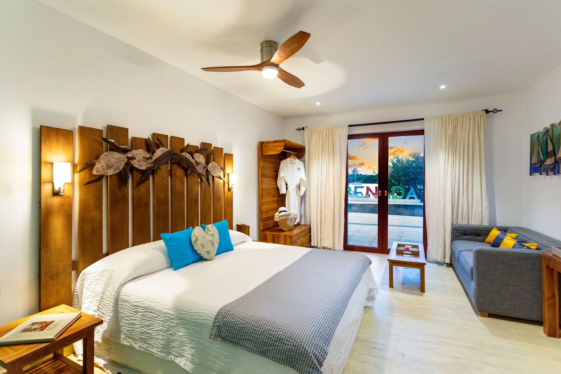 Cocoa Pod Room with king bed and sofa at True Blue Bay Resort.