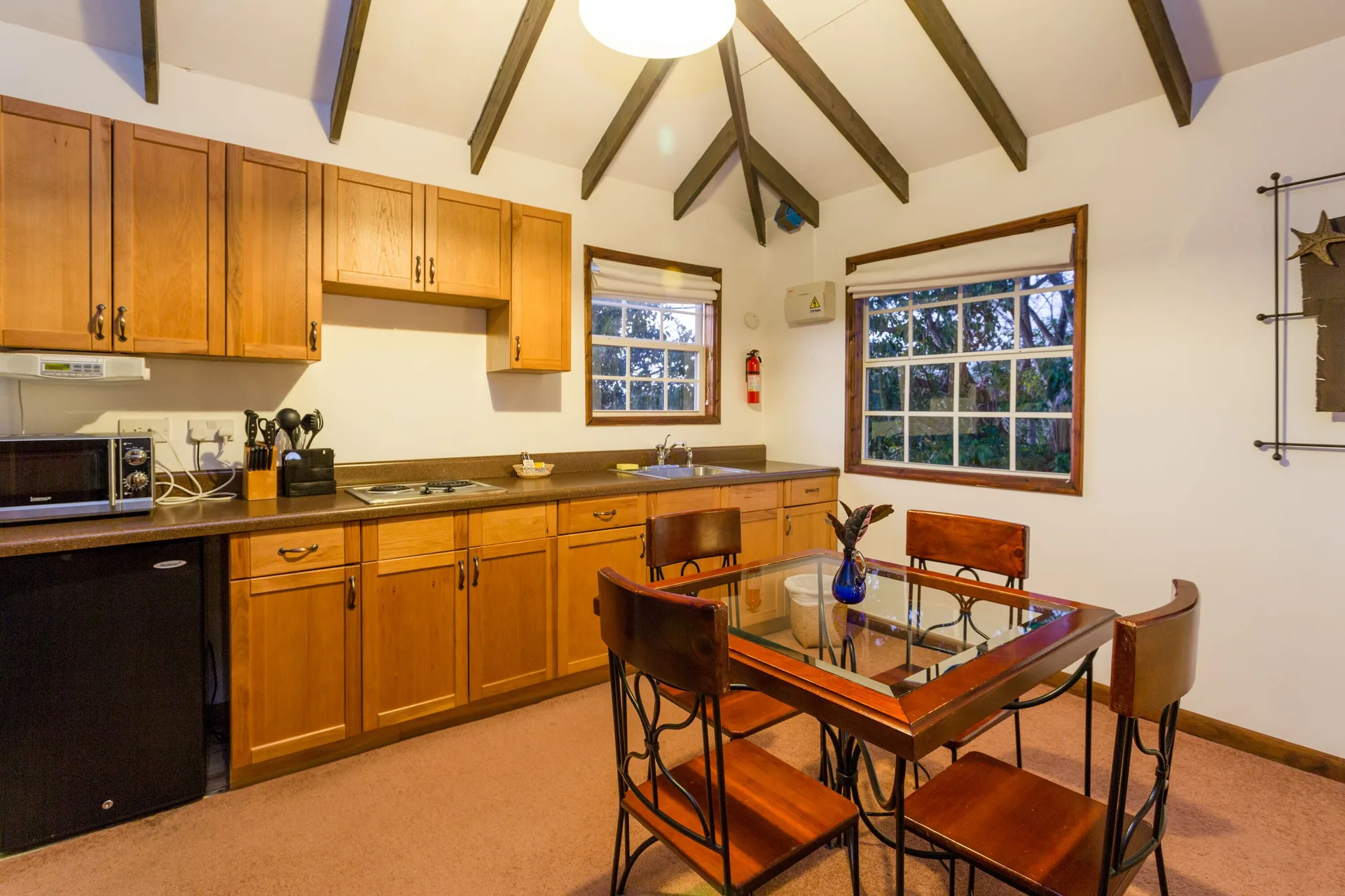 Tower Suite kitchenette and dining table at True Blue Bay Resort.