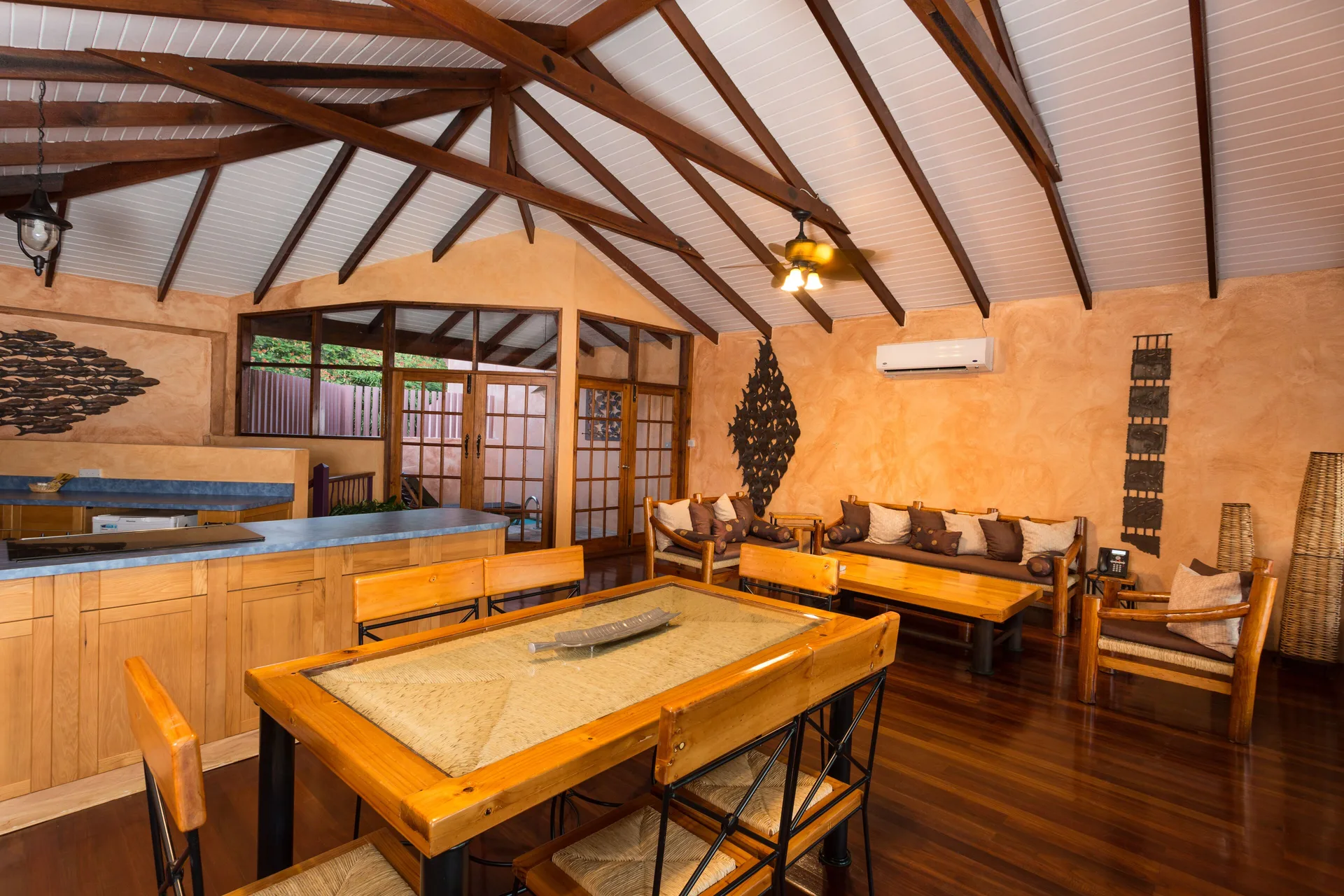 True Blue Bay Resort dining and sitting area under exposed beams at True Blue Bay Resort.