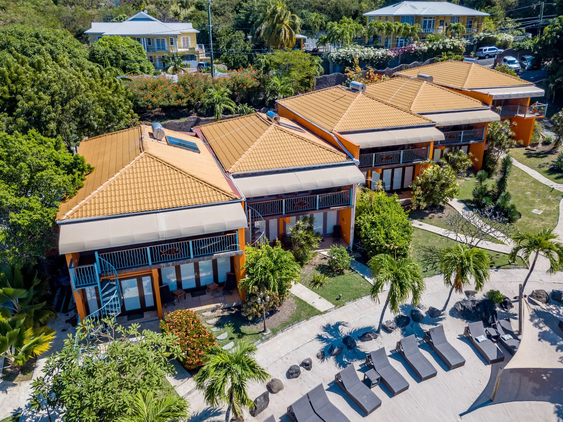 Aerial view of True Blue Bay Resort buildings and garden paths at True Blue Bay Resort.