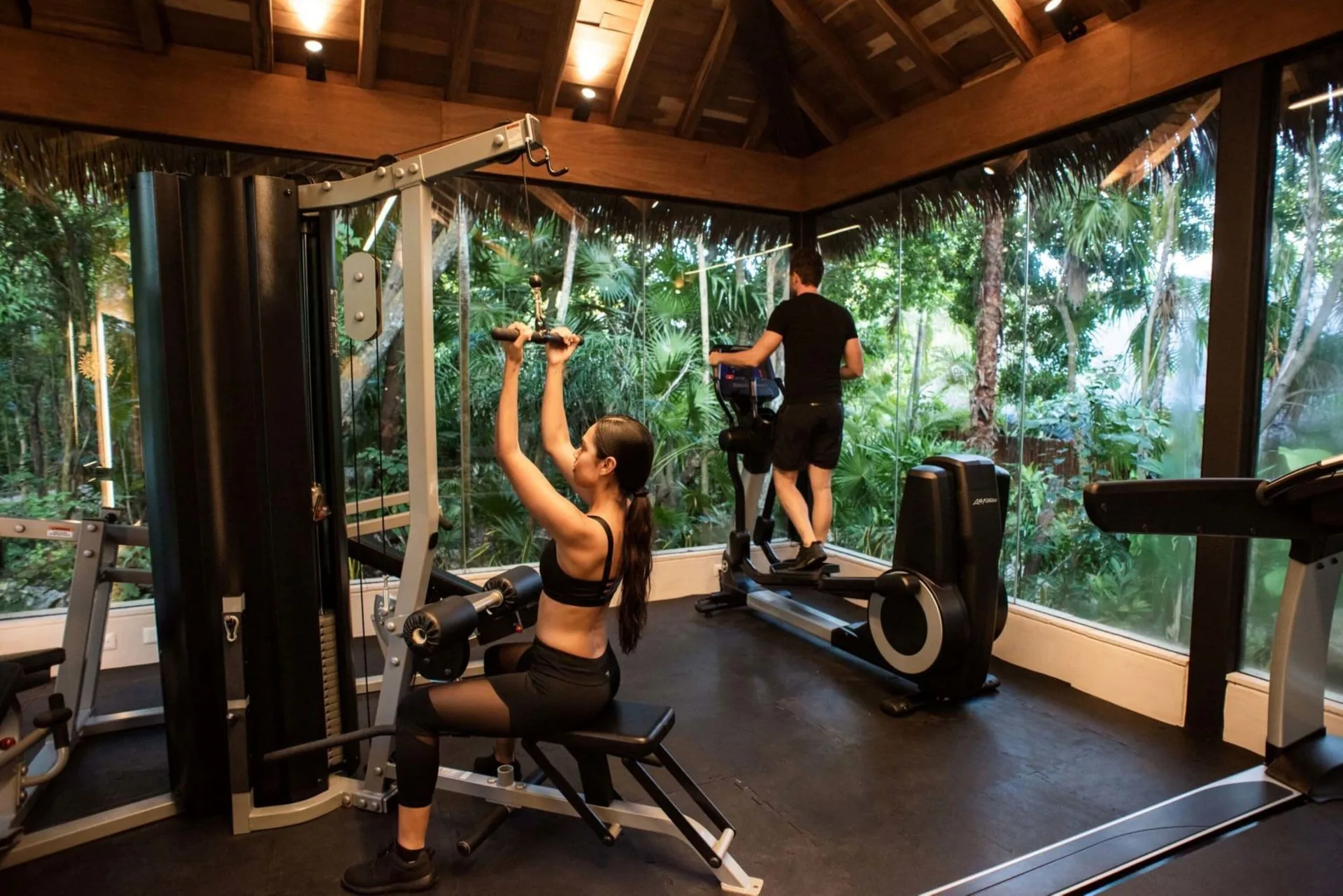 Fitness center with strength machines and treadmills at Viceroy Riviera Maya.