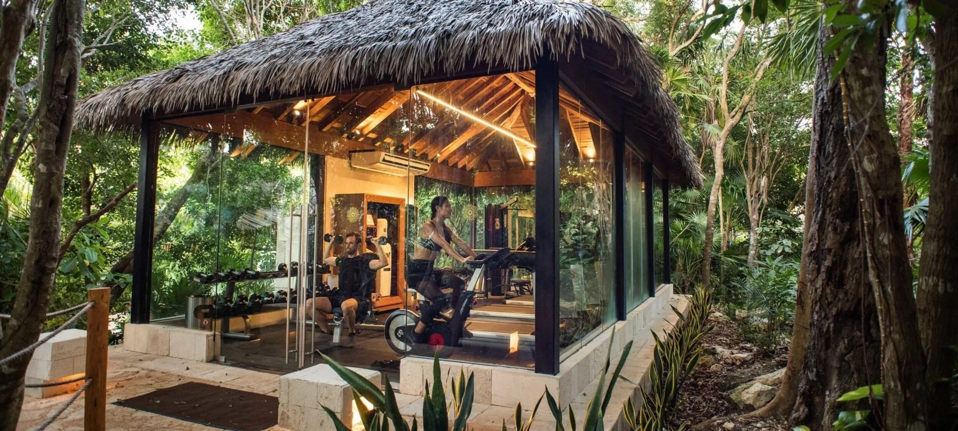 Glass-walled fitness pavilion in the jungle at Viceroy Riviera Maya.