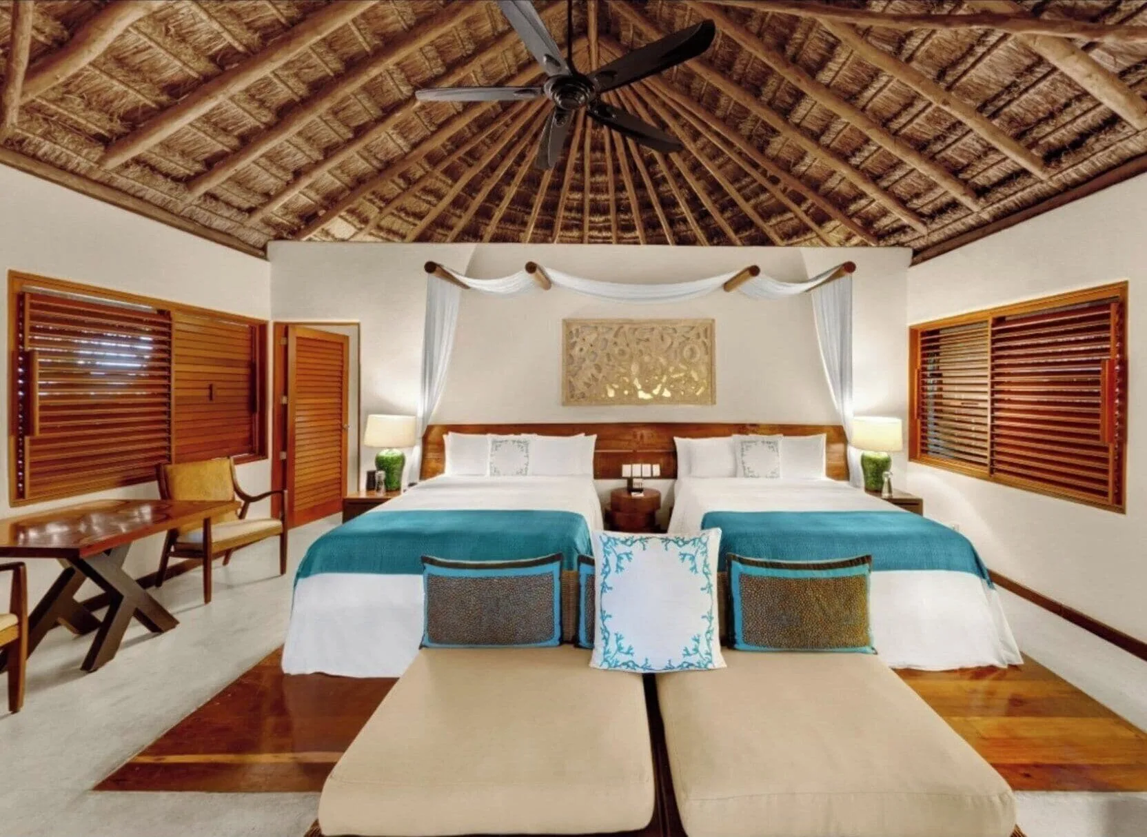 Two-bed luxury villa room with wood shutters at Viceroy Riviera Maya.