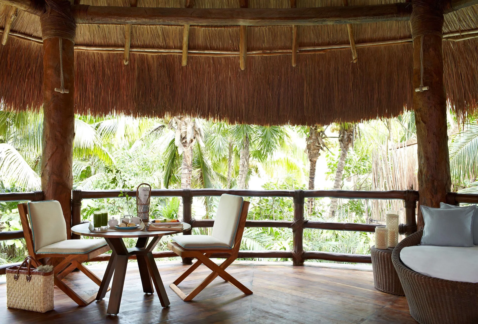 Ocean View Two Level Villa shaded balcony with lounge seating at Viceroy Riviera Maya.