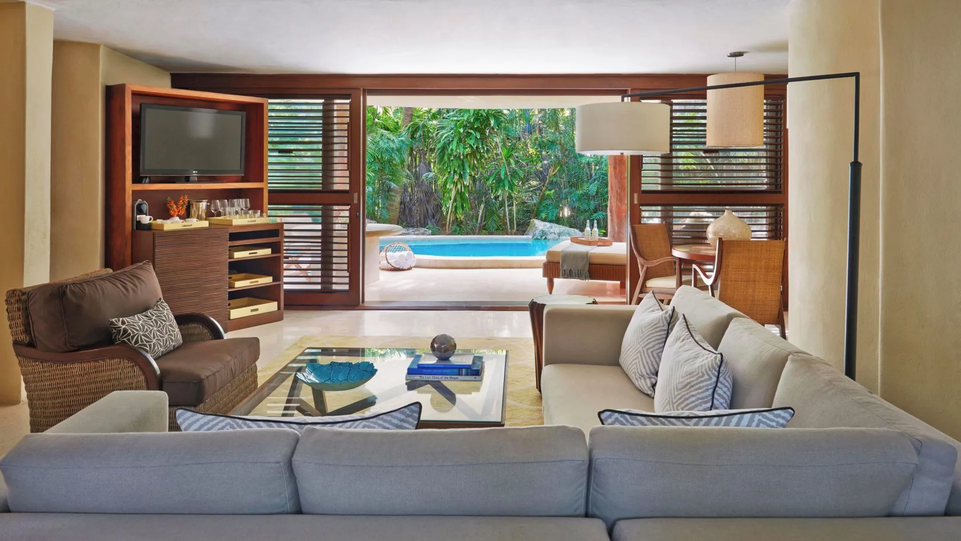 Ocean View Two Level Villa living room opening to private pool at Viceroy Riviera Maya.