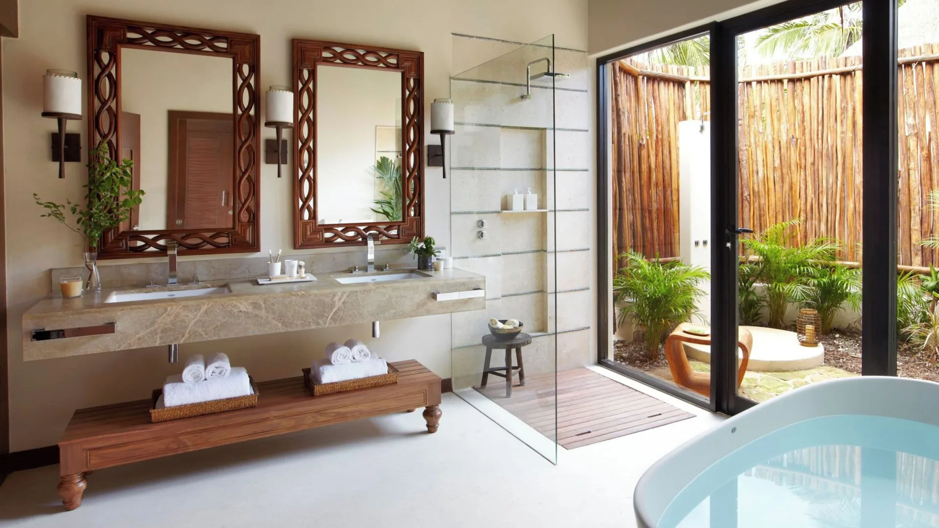 Double vanity and soaking tub in a Premium Villa bathroom at Viceroy Riviera Maya.