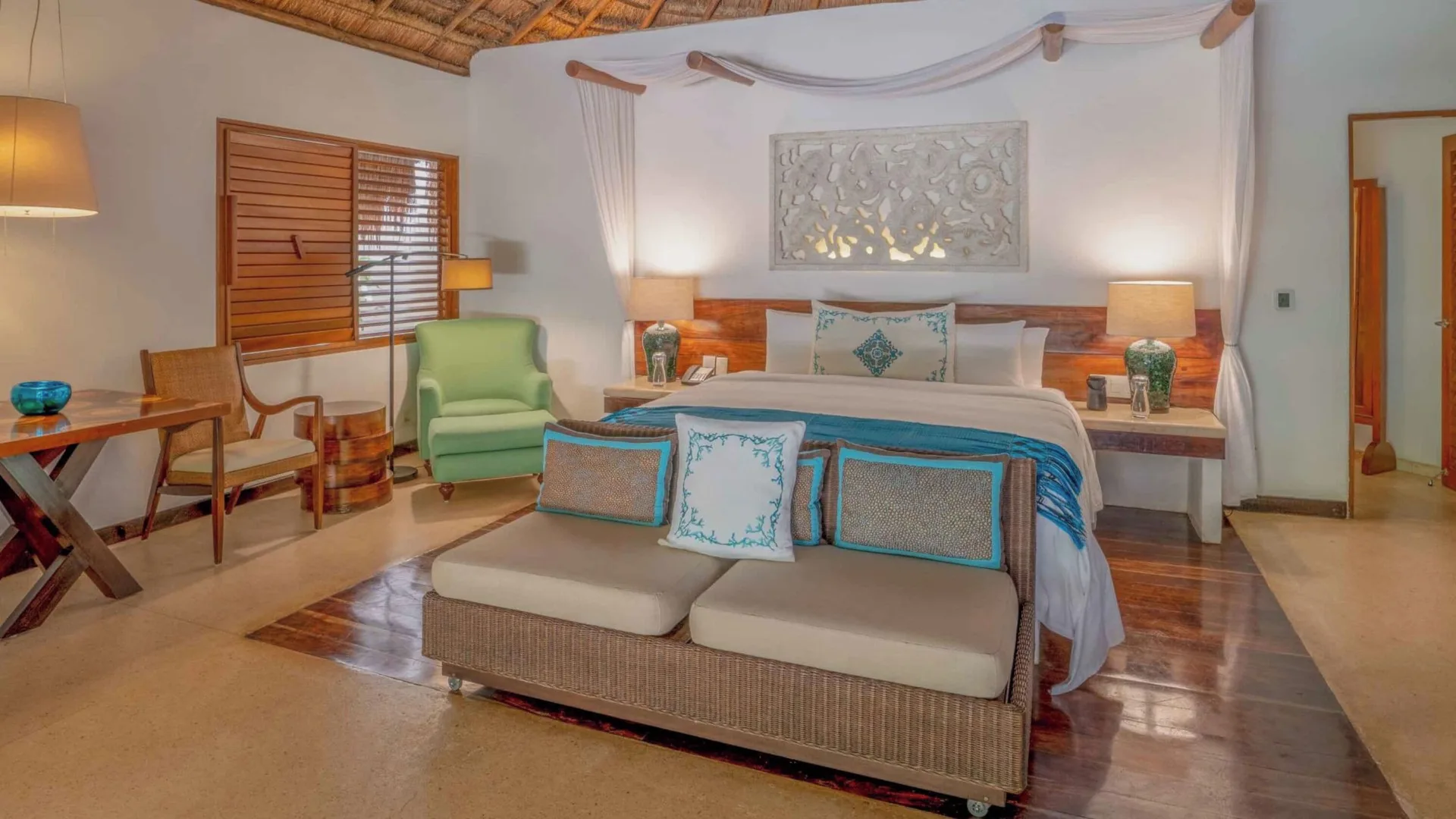 Royal Villa bedroom with king bed and seating at Viceroy Riviera Maya.