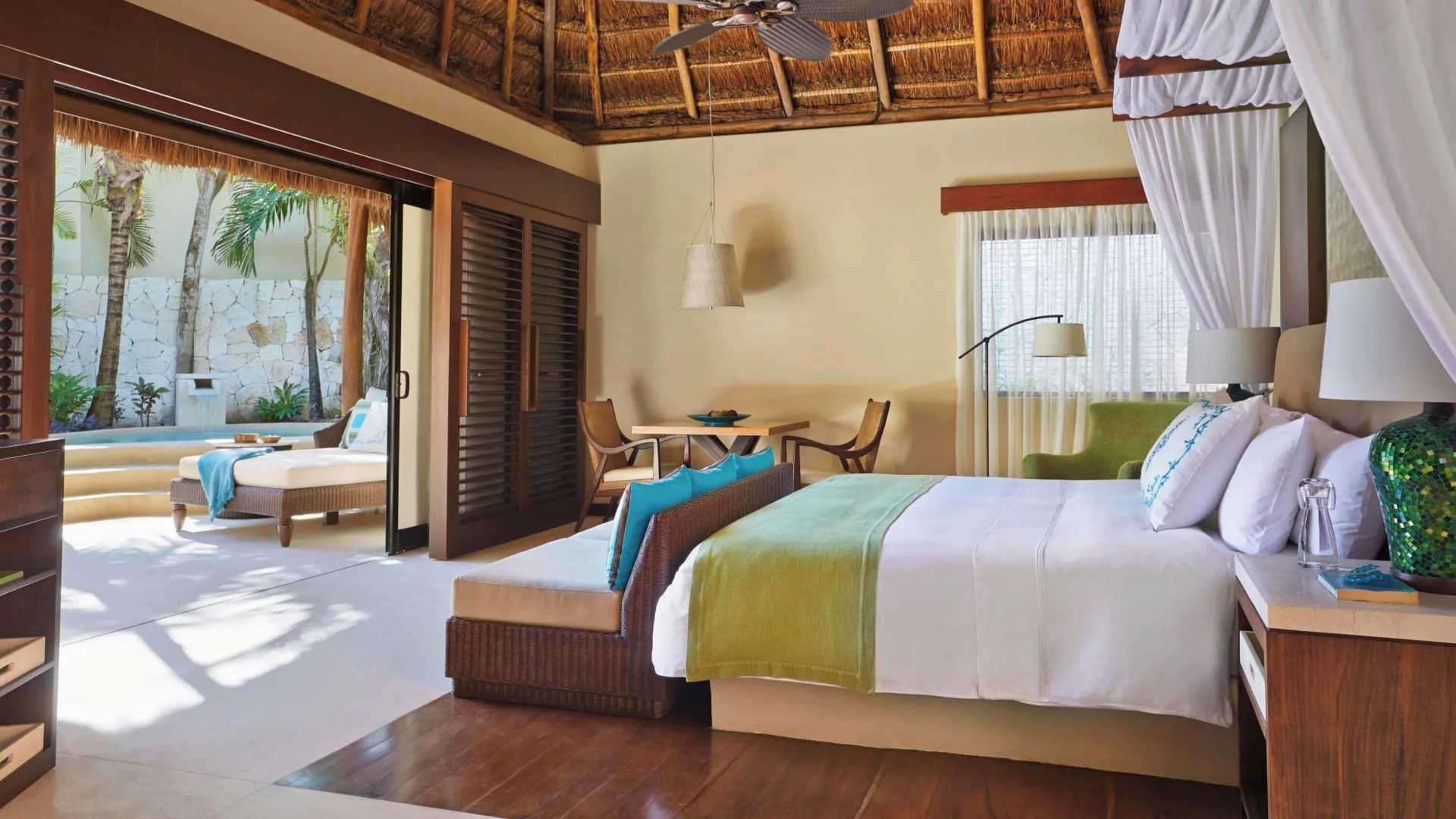 Signature Villa king bed and private deck at Viceroy Riviera Maya.
