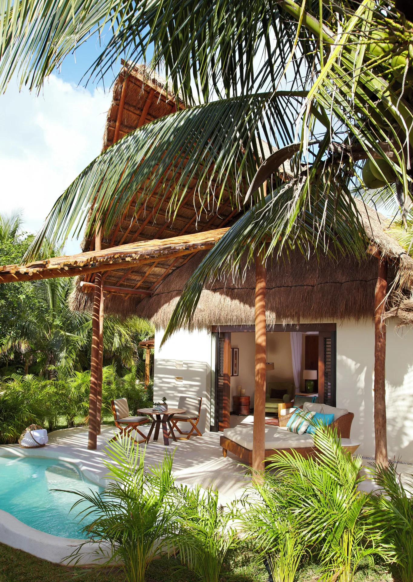 Viceroy Riviera Maya deck with plunge pool and lounge seating at Viceroy Riviera Maya.