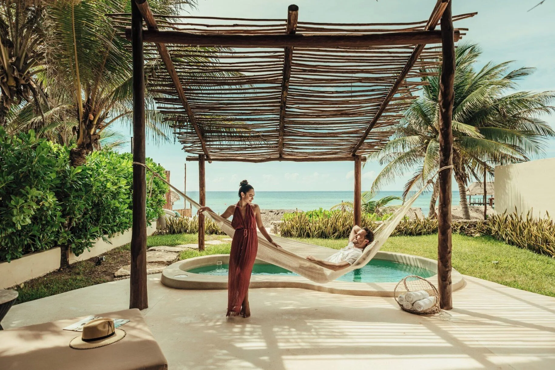 Beachfront villa deck with hammock, private pool and ocean view at Viceroy Riviera Maya.
