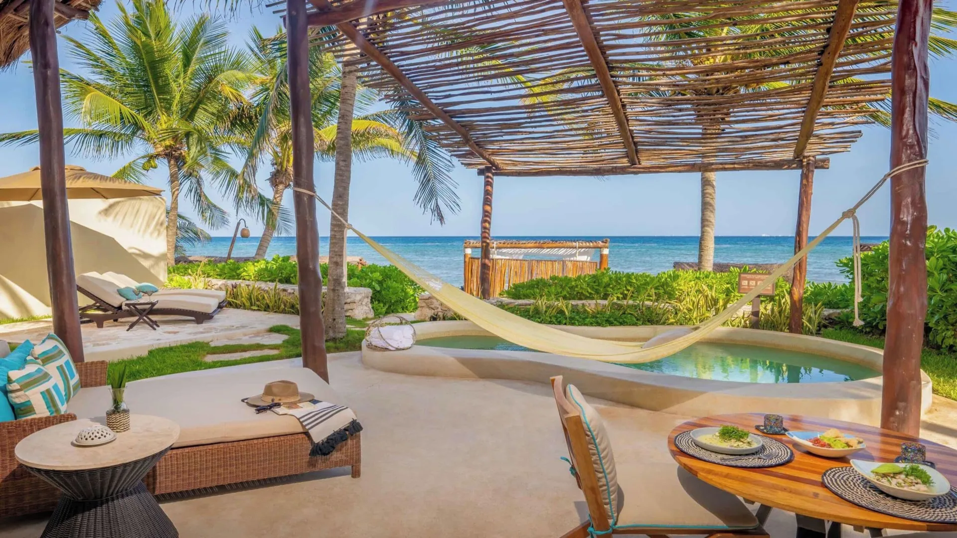 Beachfront villa deck with private pool and ocean view at Viceroy Riviera Maya.