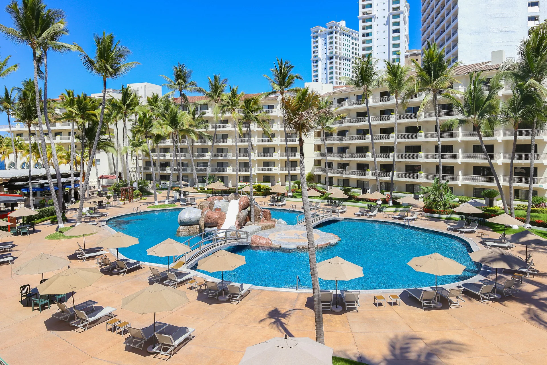 Courtyard pool and palms at Villa del Palmar Beach Resort and Spa, Puerto Vallarta.