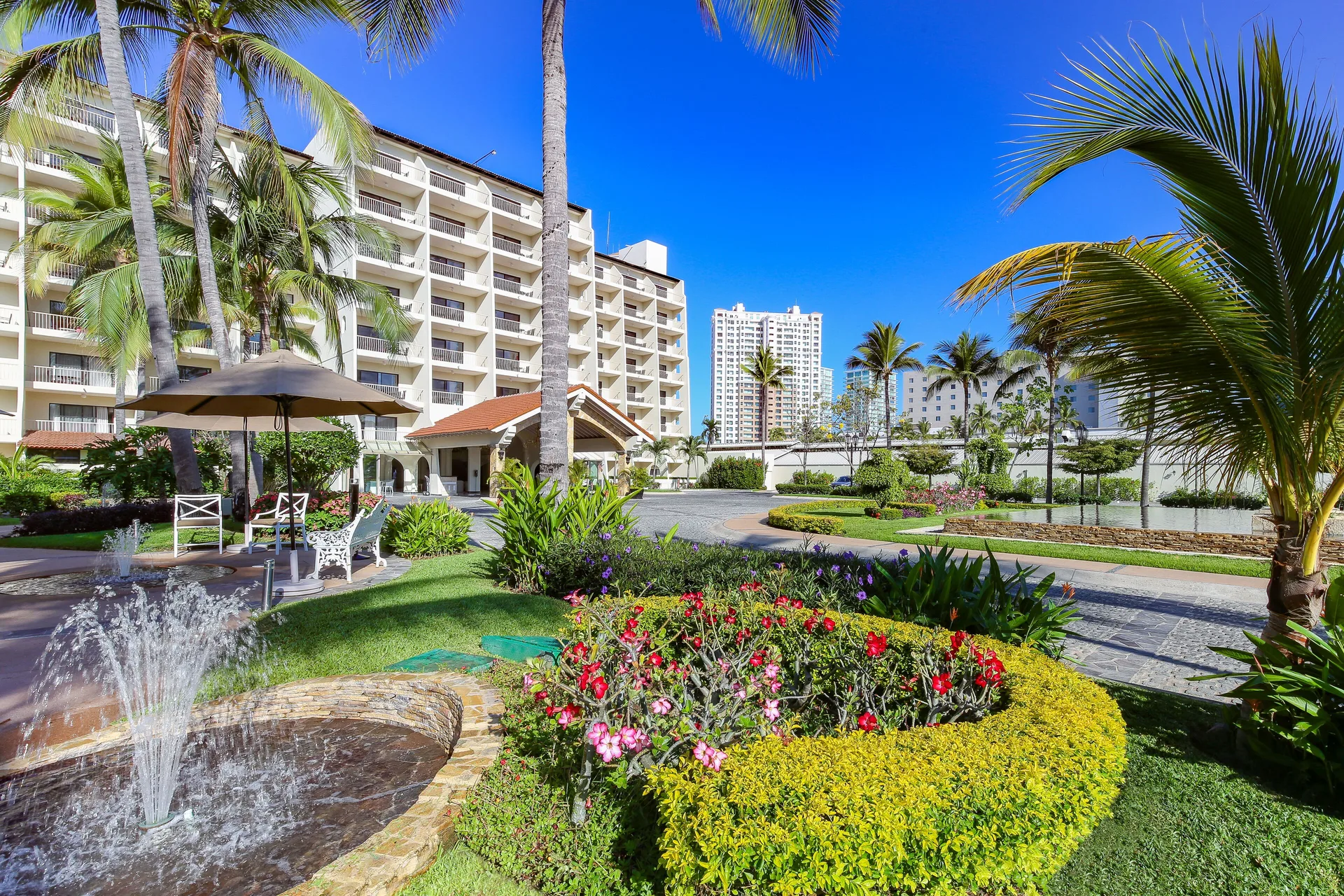 Garden courtyard with fountain at Villa del Palmar Beach Resort and Spa, Puerto Vallarta.
