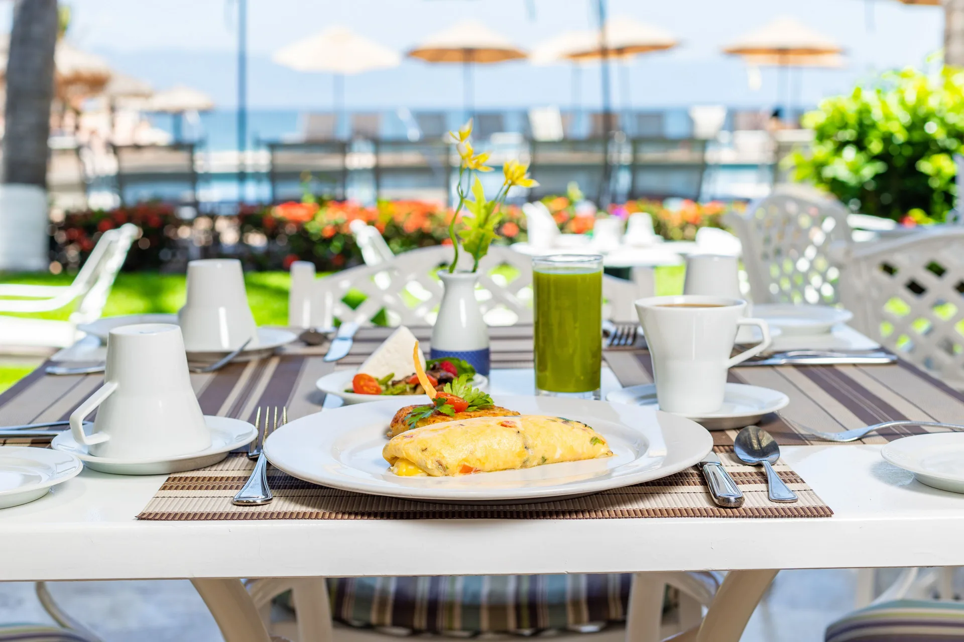 Breakfast table by the beach at Villa del Palmar Beach Resort and Spa, Puerto Vallarta.