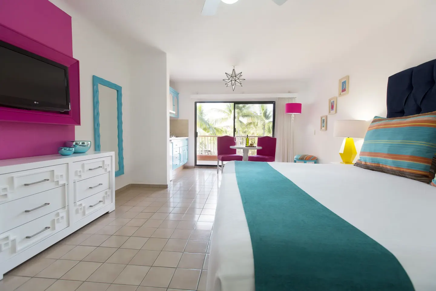 Junior Suite with king bed, seating area, kitchenette, and balcony at Villa del Palmar Beach Resort and Spa, Puerto Vallarta.