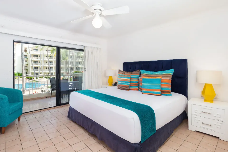 Superior Two Bedroom Suite king bedroom with balcony at Villa del Palmar Beach Resort and Spa, Puerto Vallarta.