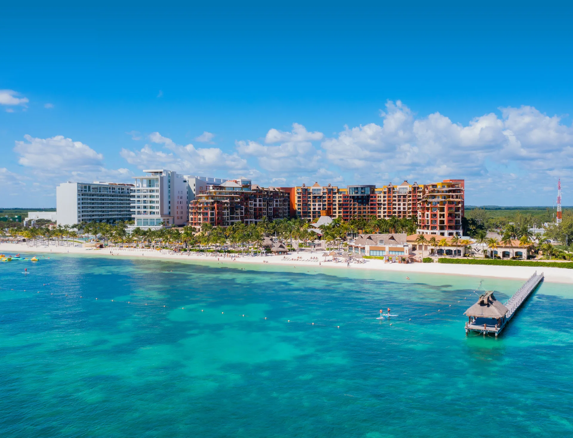Aerial beachfront view of Villa del Palmar Cancun Beach Resort & Spa beside turquoise water.