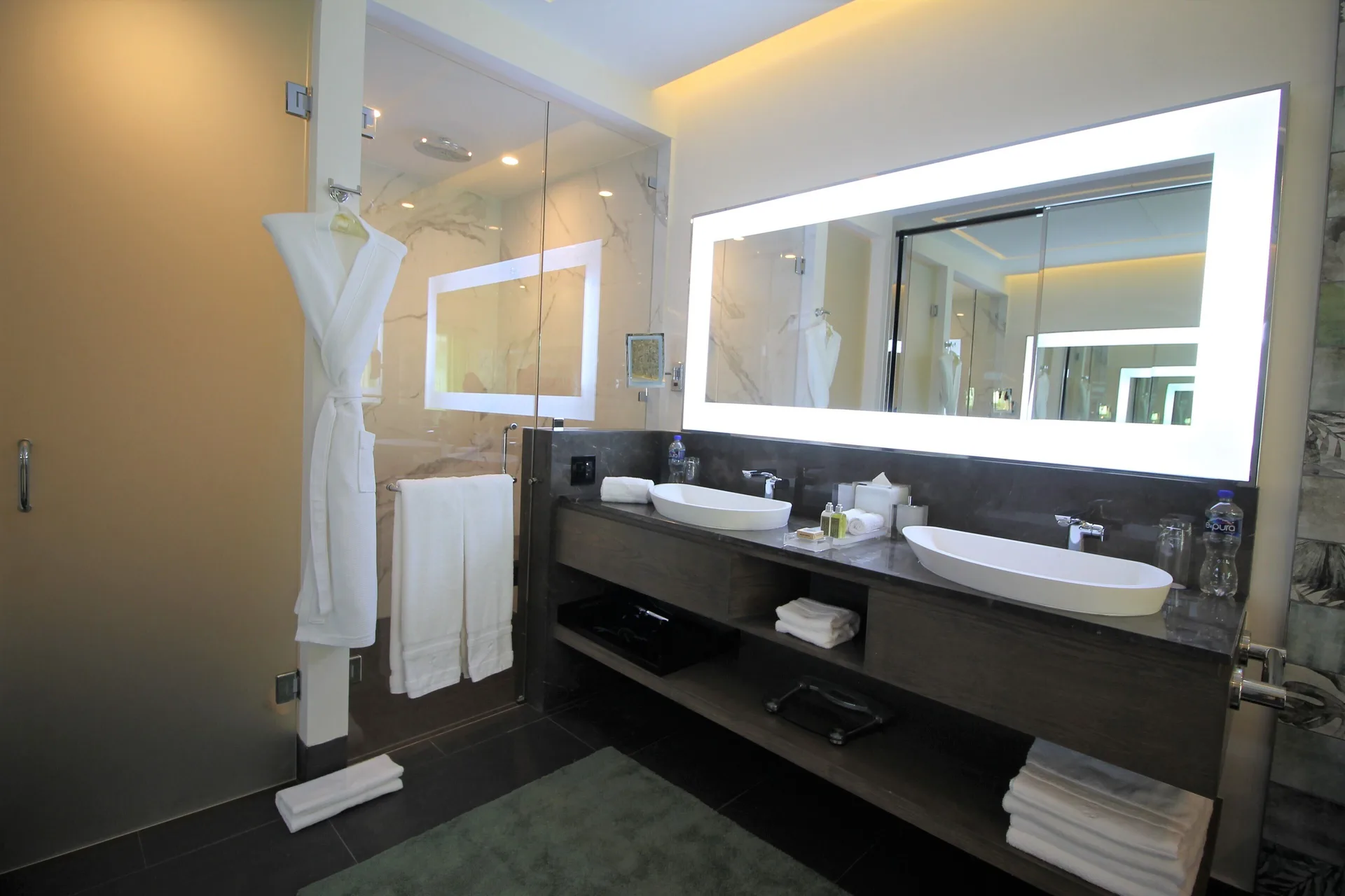 Double vanity bathroom with glass shower at Villa del Palmar Cancun Beach Resort & Spa.