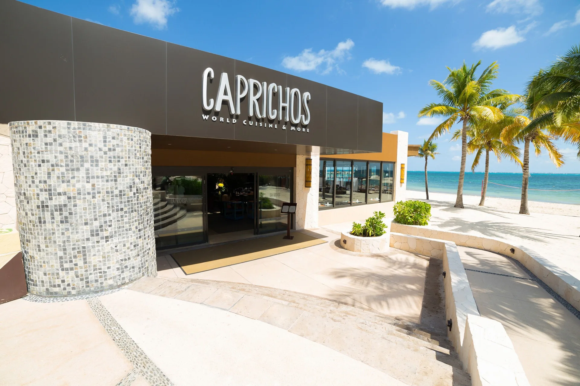 Caprichos restaurant entrance by the beach at Villa del Palmar Cancun Beach Resort & Spa.