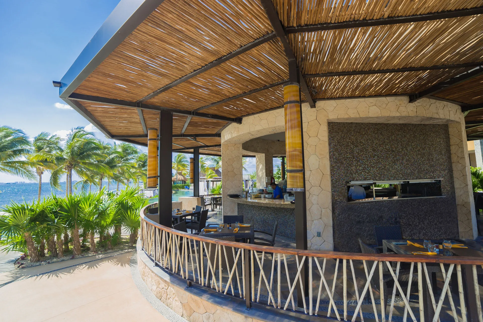 Open-air seaside dining terrace at Villa del Palmar Cancun Beach Resort & Spa.