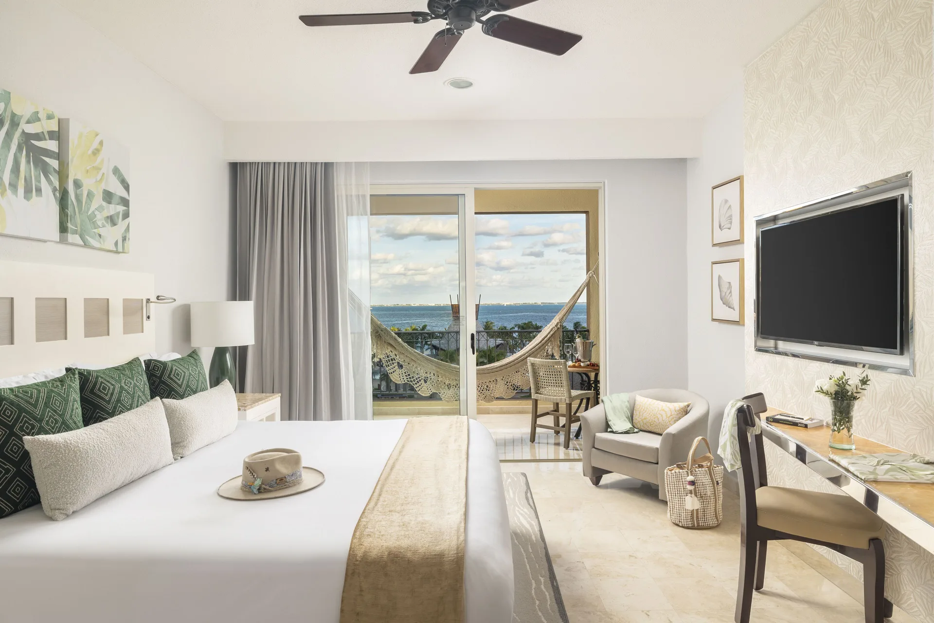 Deluxe Ocean View king room with balcony hammock at Villa del Palmar Cancun Beach Resort & Spa.