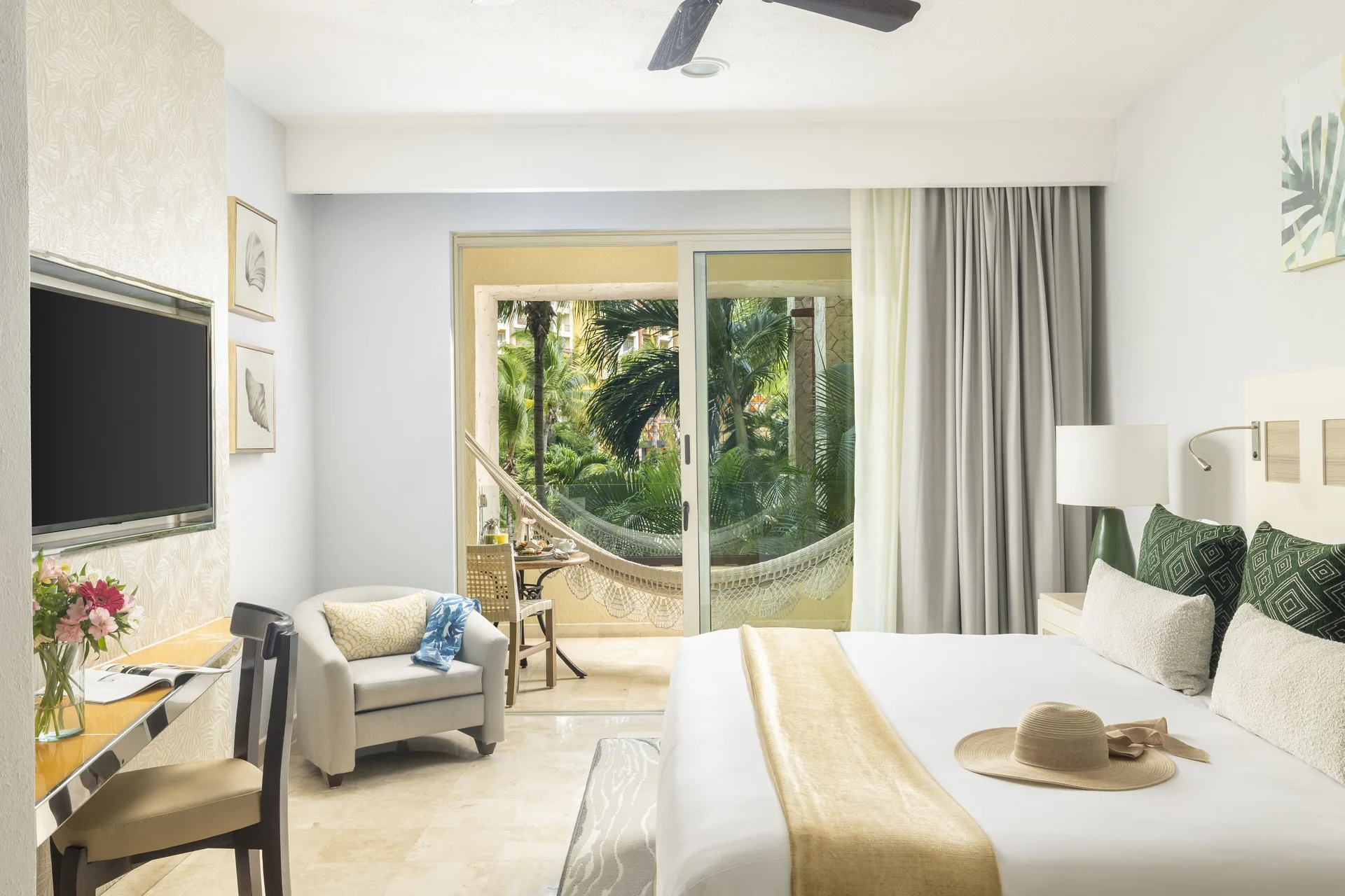 Deluxe room king bed with balcony hammock and garden view at Villa del Palmar Cancun Beach Resort & Spa.