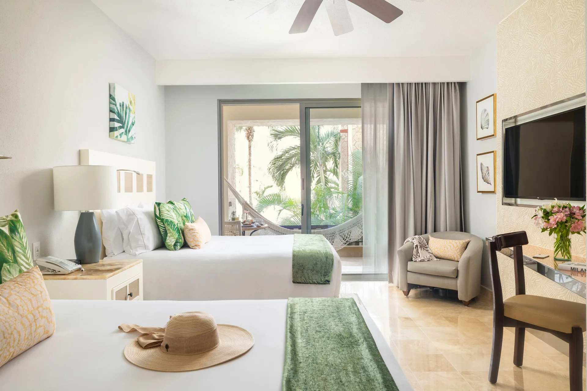 Deluxe room with two beds and balcony hammock at Villa del Palmar Cancun Beach Resort & Spa.