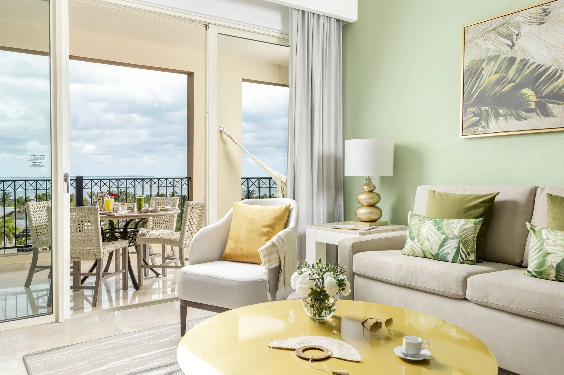 One Bedroom Ocean View living area and balcony at Villa del Palmar Cancun Beach Resort & Spa.